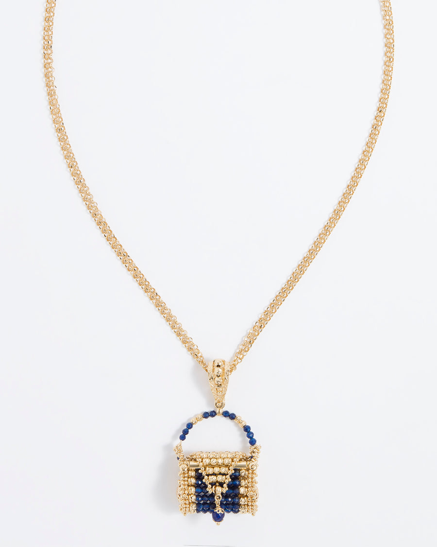 Product shot of a tiny little gold jewel woven bag hung from a double folded necklace.