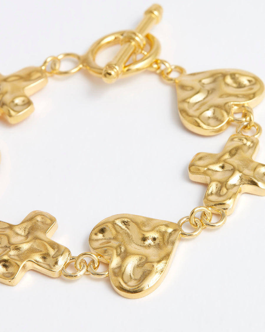 Soru bracelet features interlocking mixed heart and cross links with a toggle clasp fastening for ease.