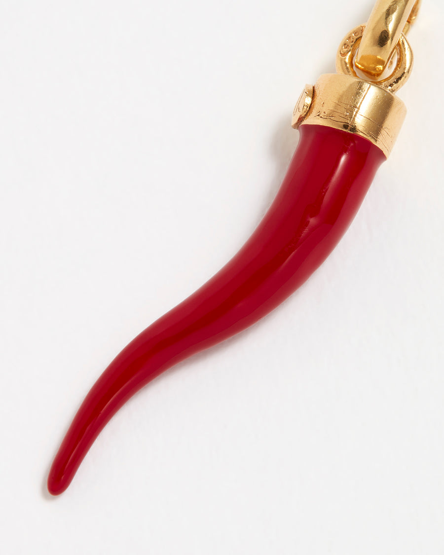 Close up Image of a red coral Cornucopia horn shaped charm with gold top connector