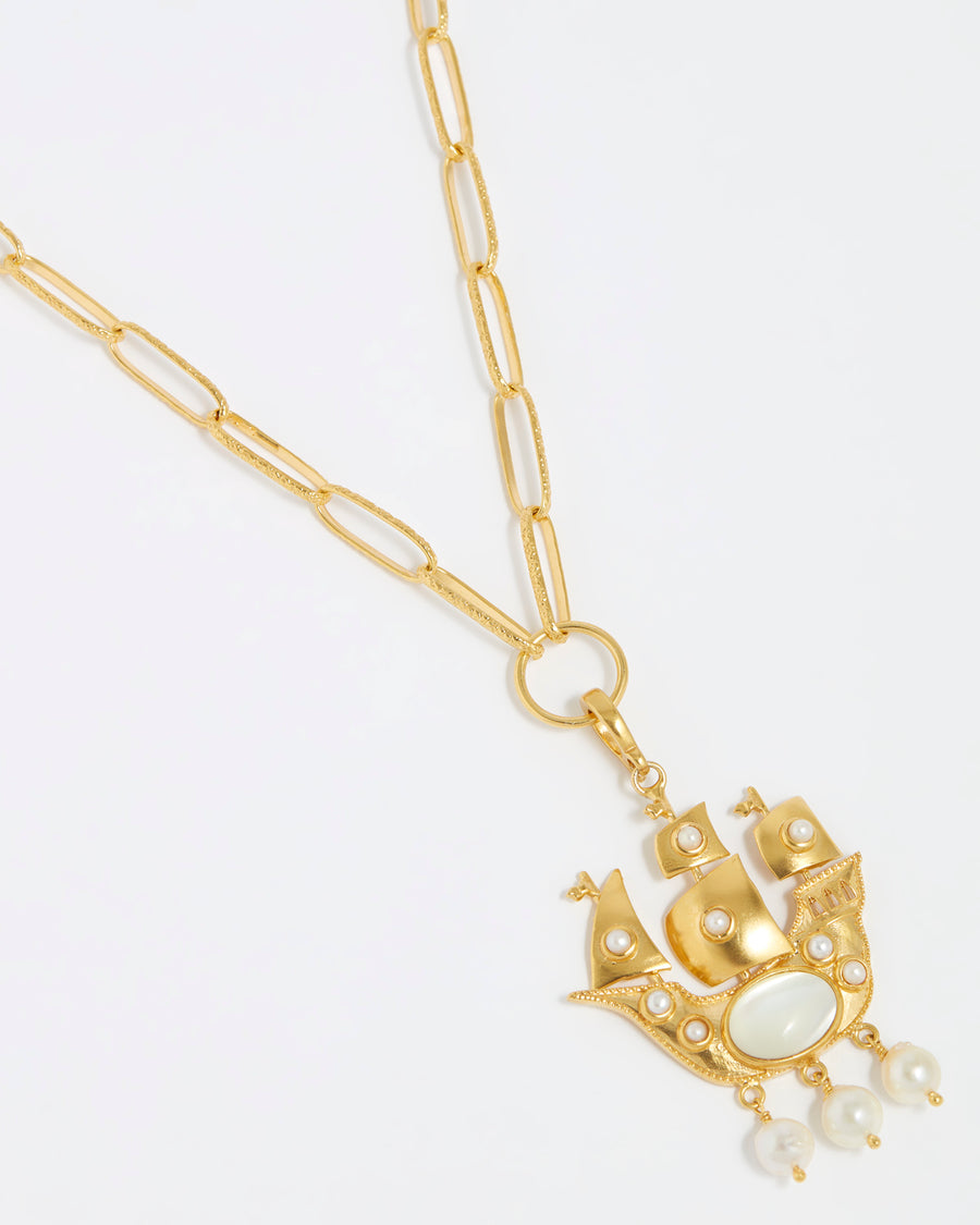product shot of Soru Jewellery pearl embellished ship charm on a charm chain necklace on white background