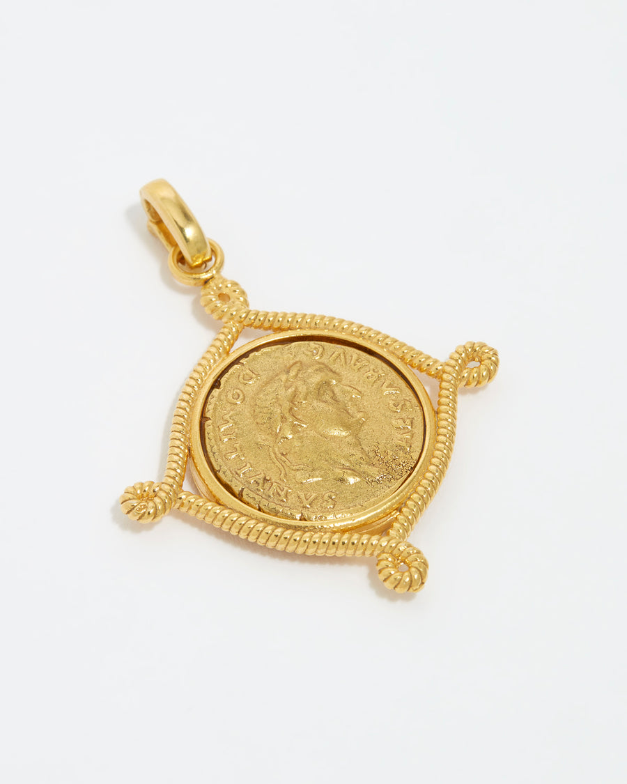 close up image shot of gold coin charm on a white background