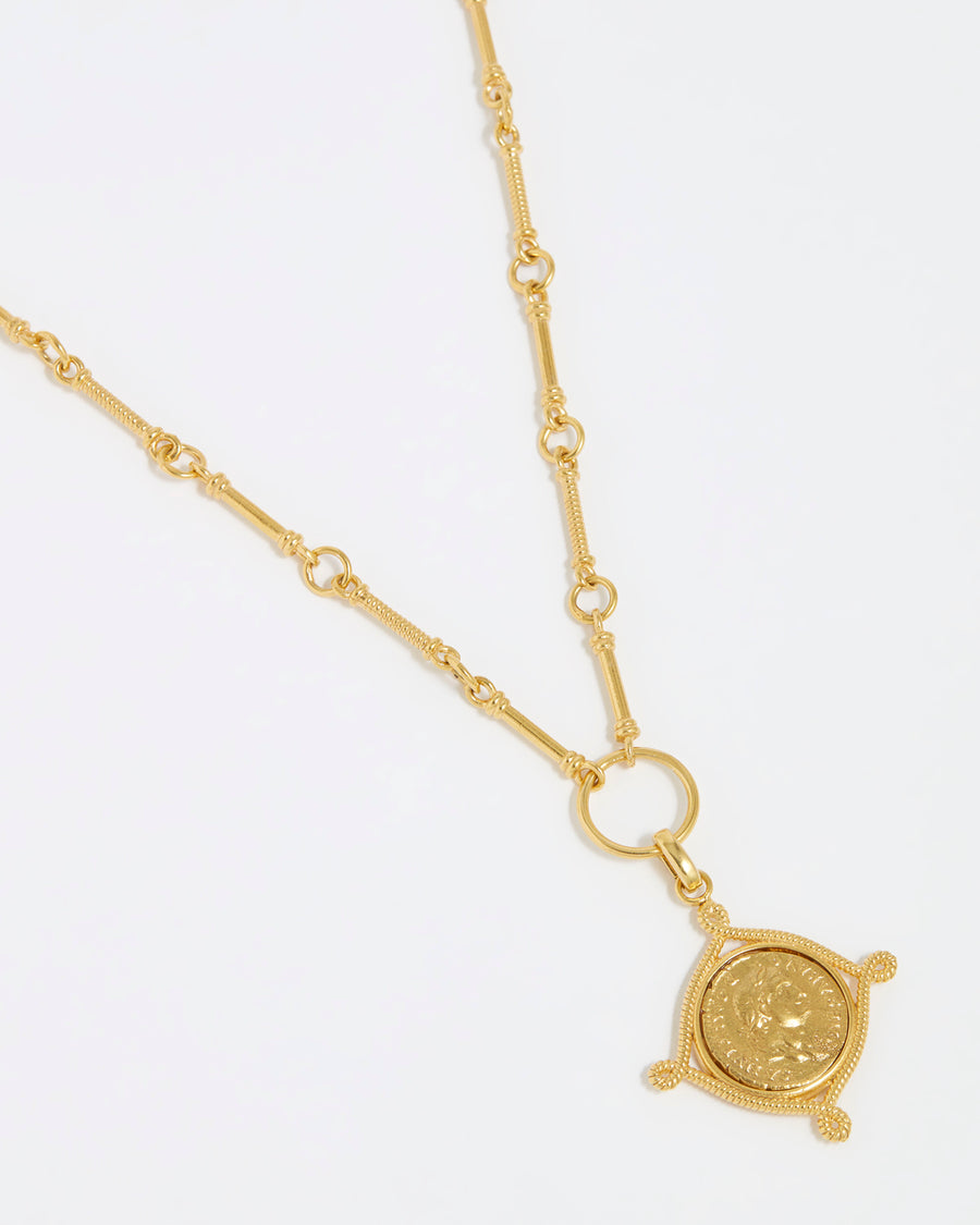 Product shot of Soru Jewellery gold coin charm attached to a charm chain on a white background