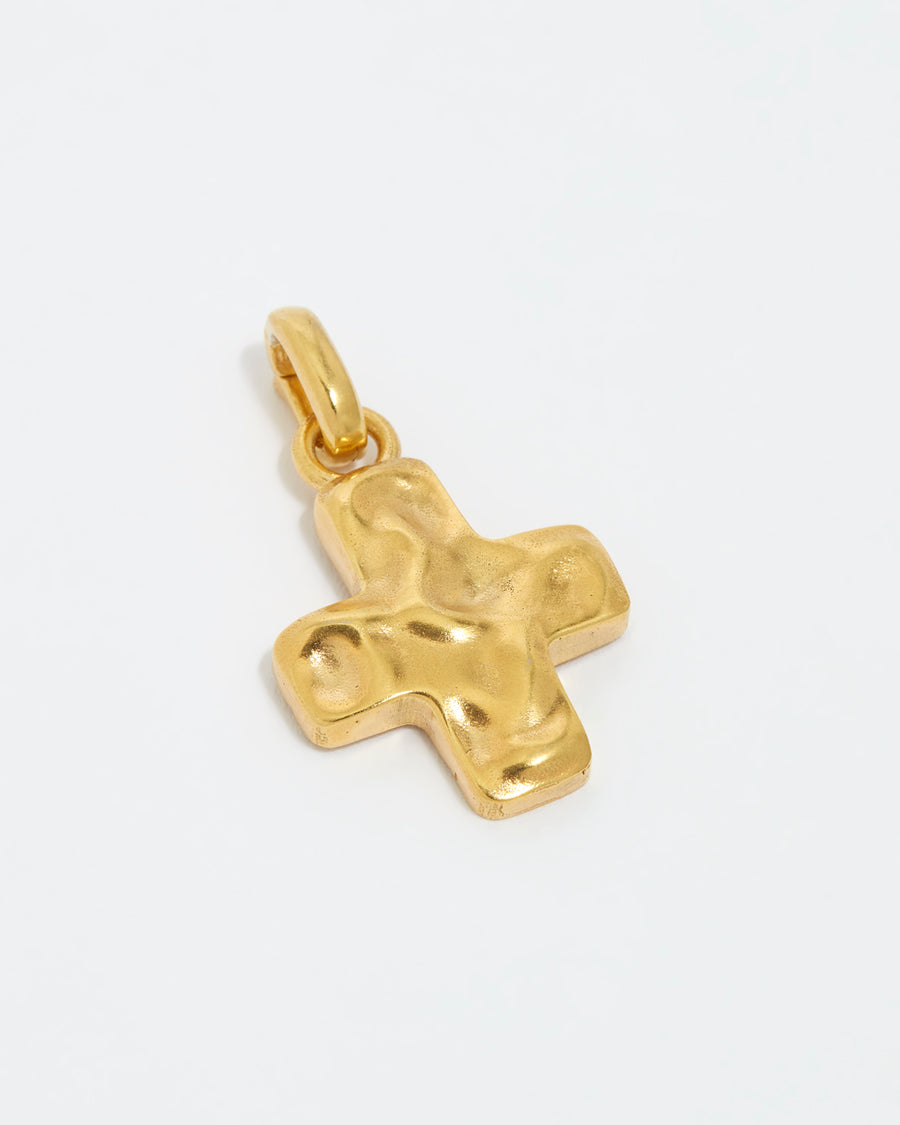 Product shot of soru jewellery detachable gold cross charm on a white background