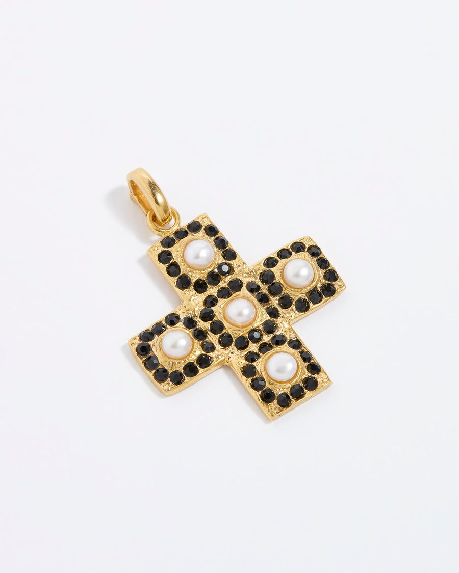 Product image of a gold textured cross-shaped pendant embellished with alternating baroque pearls and black crystals on a white background.