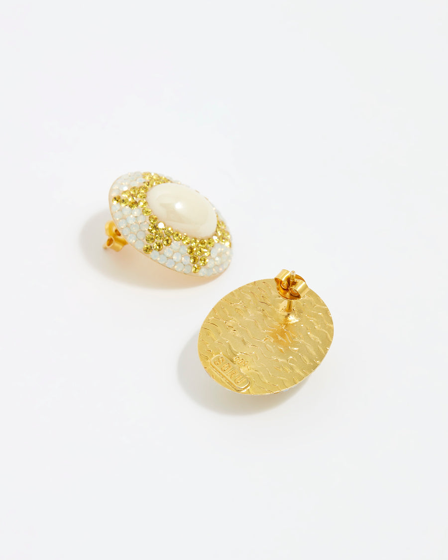 Product shot of reverse and front large pearl stud earrings surrounded by crystals