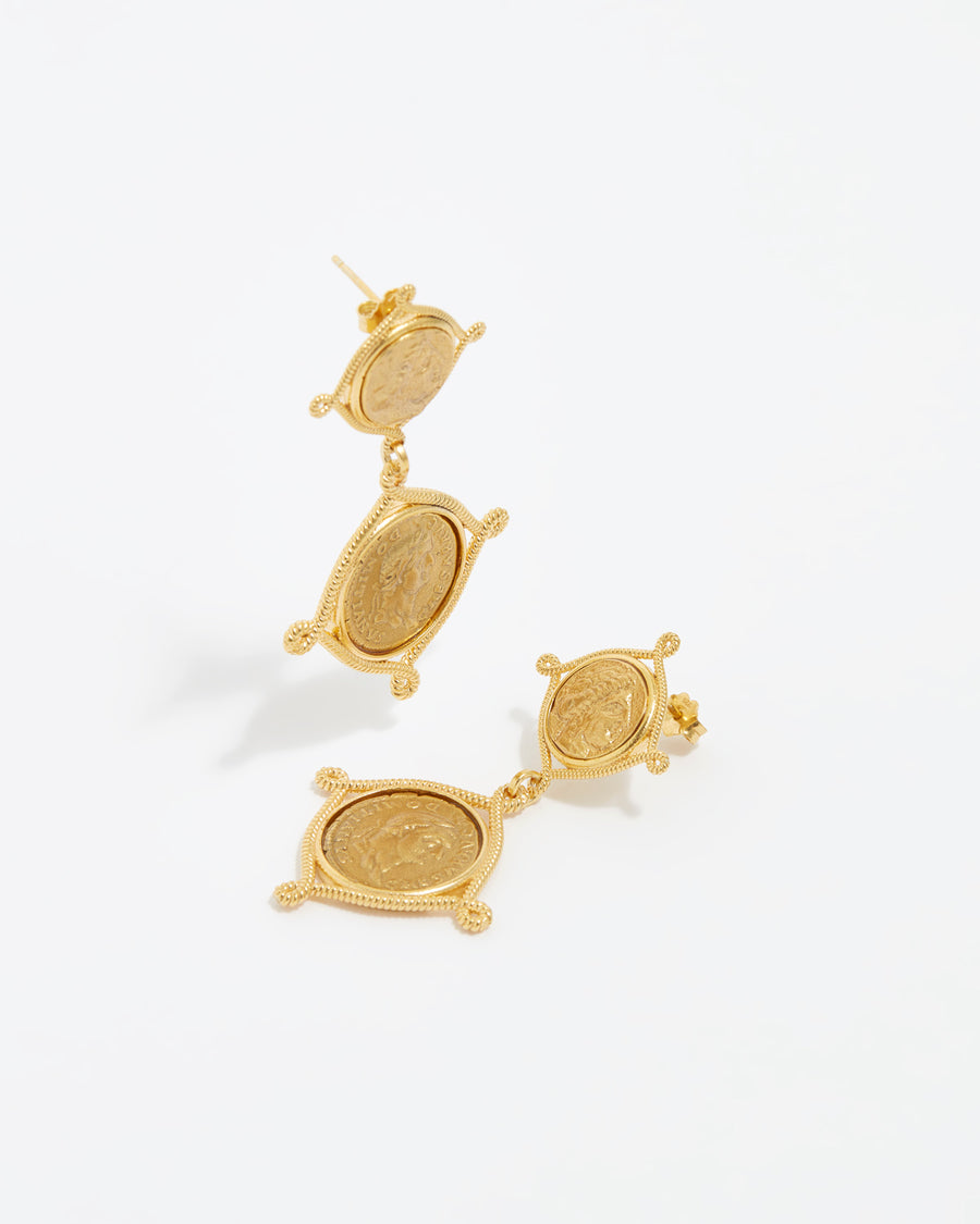 Product shot of gold double drop coin earrings on a white background