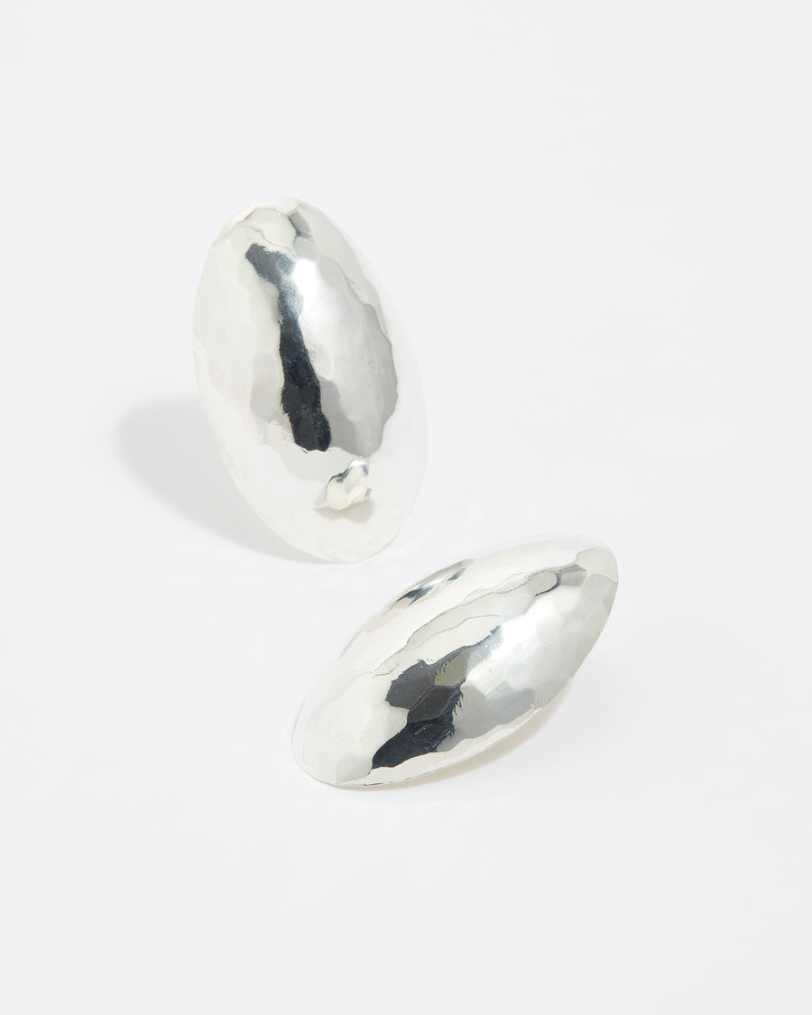 product shot of oversized textured silver oval earrings on a white background