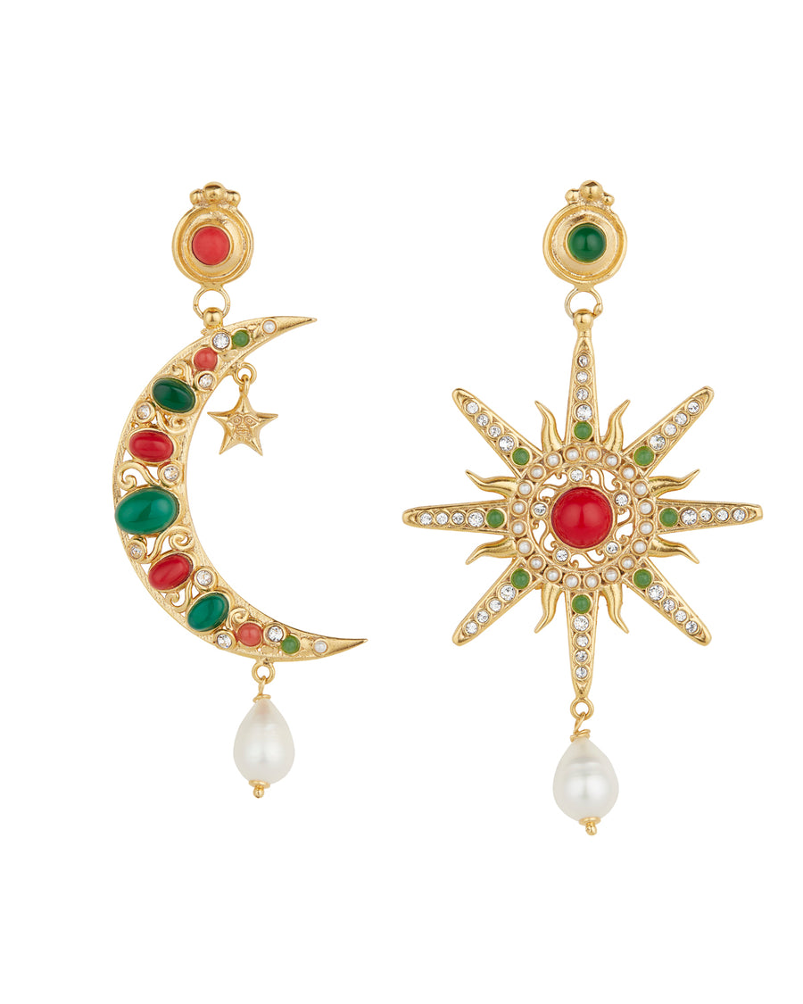 Product shot of mis-matched statement earrings, one featuring a star and the other a crescent moon. Detailed with hanging pearls and colourful green and red stones, on a white background.