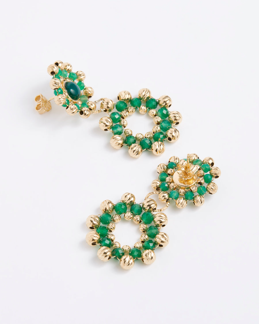 Close up of side and reverse product shot of double drop flower earrings featuring emerald green agate stones, each surrounded by delicate gold cutwork beading, on a white background