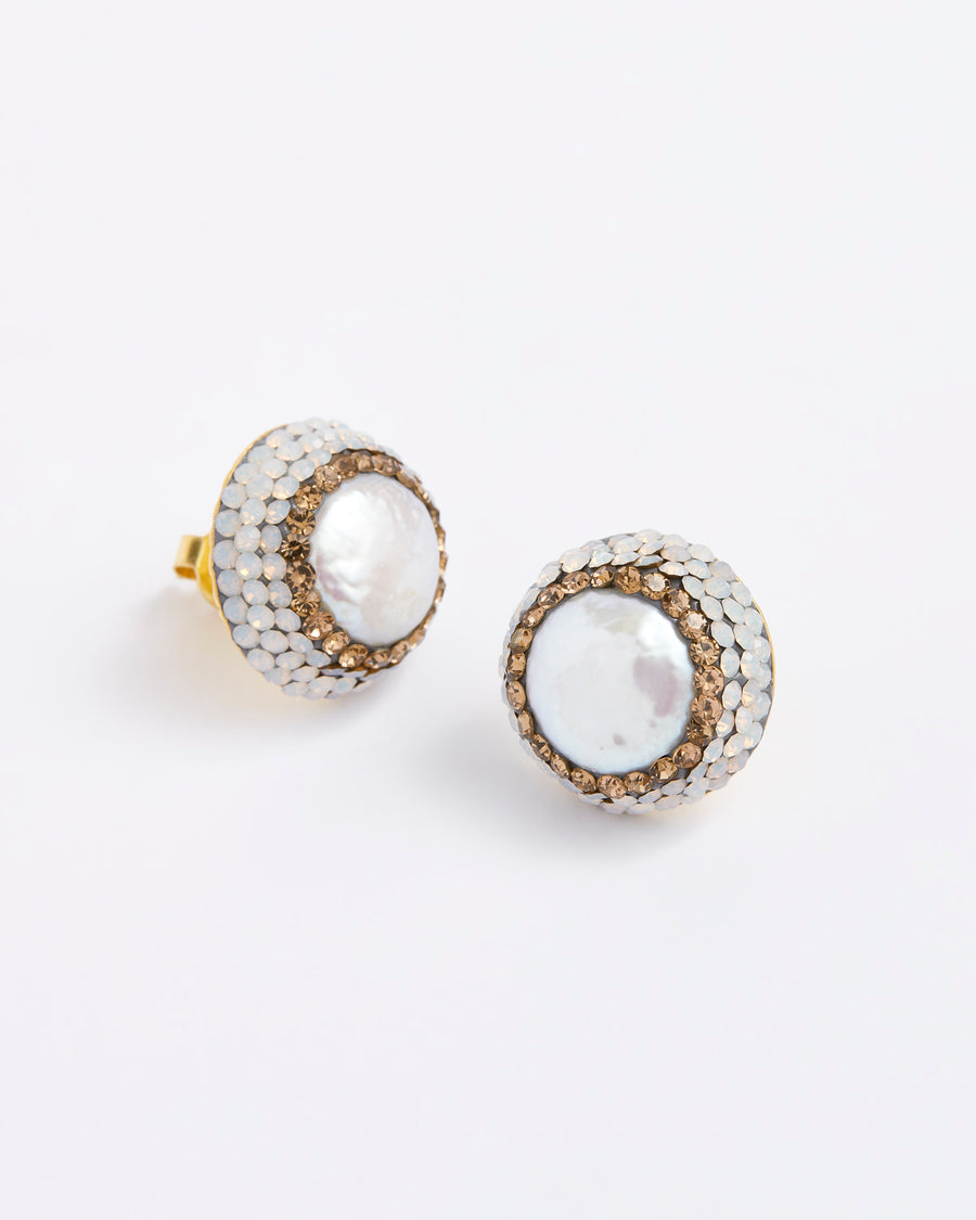 image on a white background of pearl stud earrings surrounded by crystals