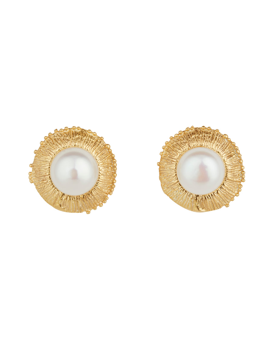 Product image of pearl stud earrings  set into a textured border resembling rays on a white background.