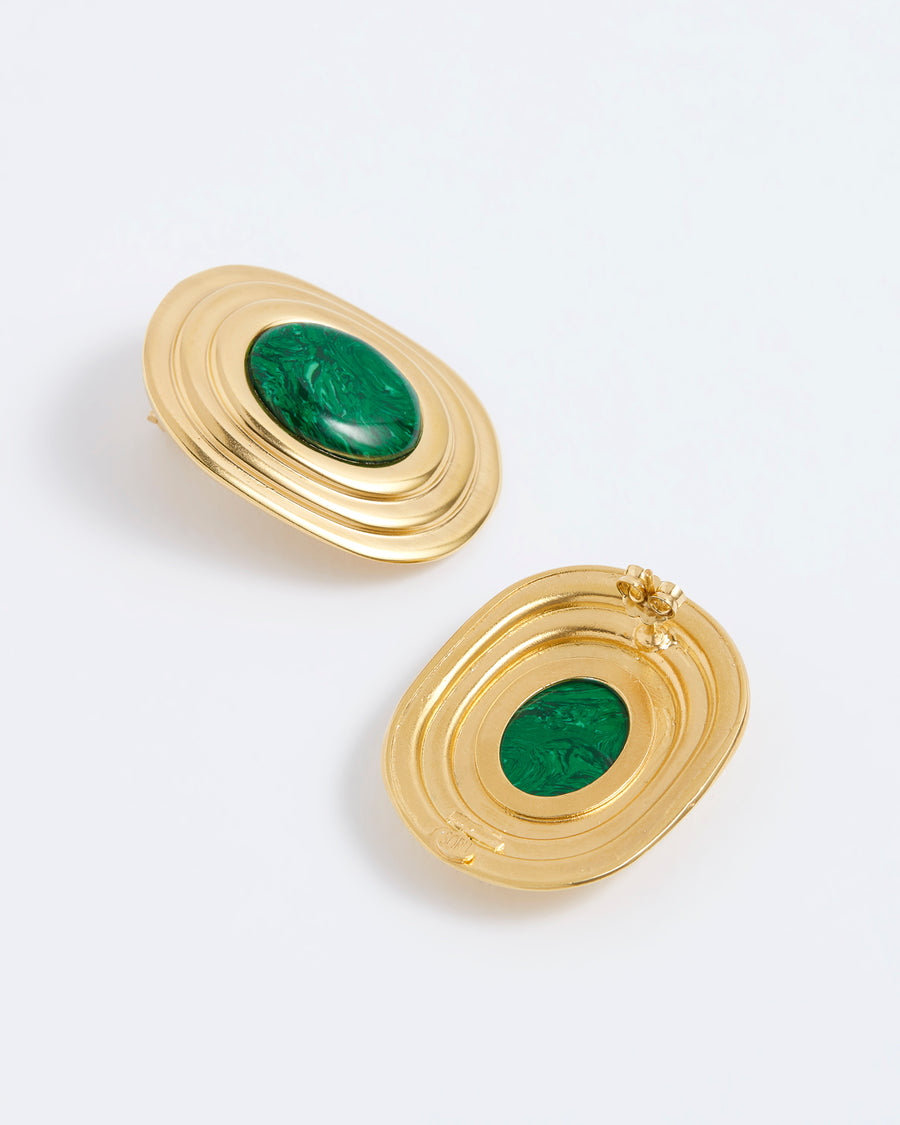 Front and behind shot of statement gold earrings with ridged edge and bold green centre, on white background