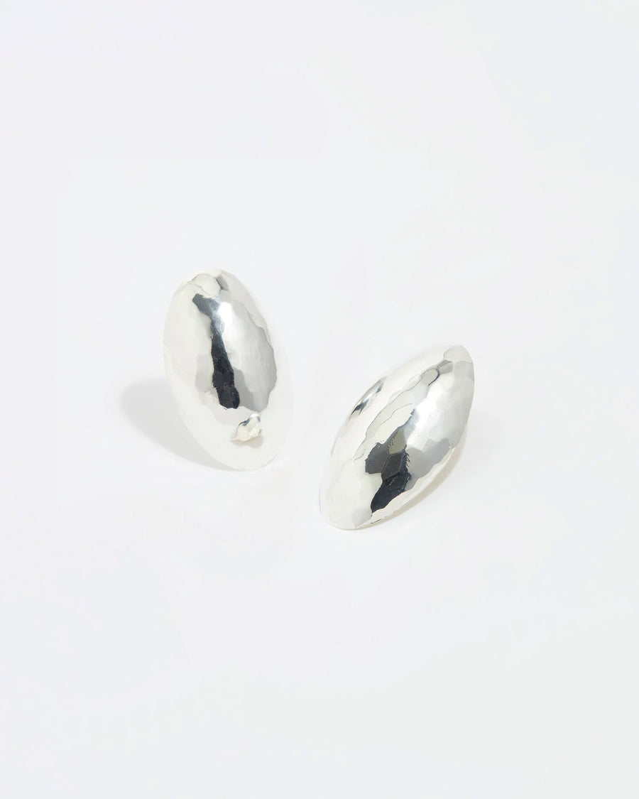 Product shot of modern silver stud earrings, featuring a delicate hammered effect to the surface