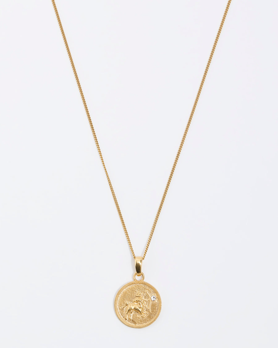 Saggitarius Zodiac circular gold pendant on a fine gold chain necklace.