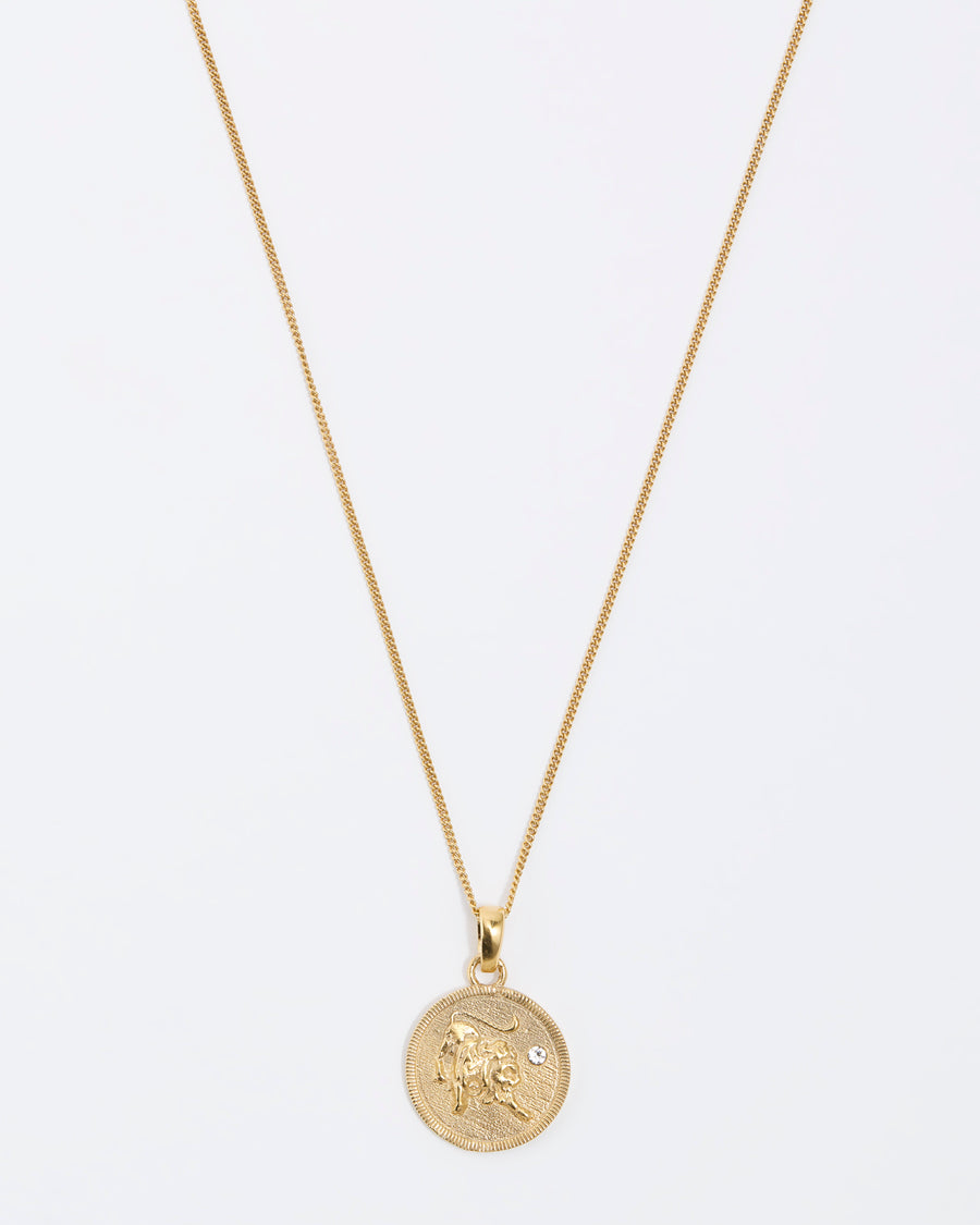 Lion lion Zodiac circular gold pendant on a fine gold chain necklace.