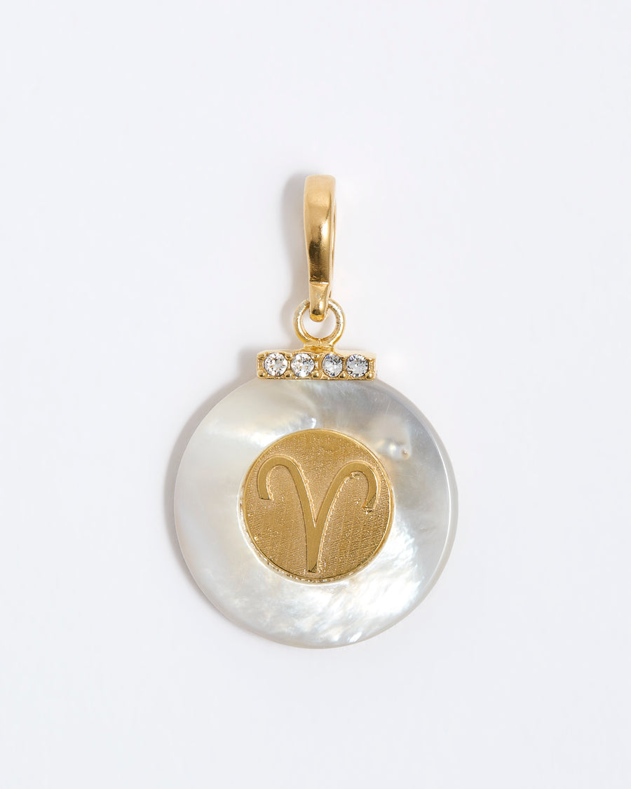 product shot - Aries engraved gold coin with chunky pearl outer and diamond detailing placed on a white background