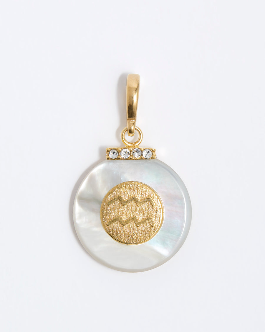 product shot - Aquarius engraved gold coin with chunky pearl outer and diamond detailing placed on a white background