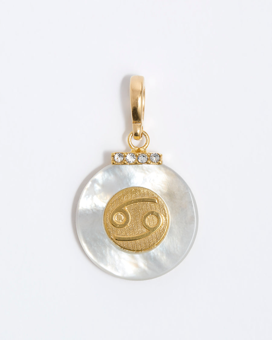 product shot - Cancer engraved gold coin with chunky pearl outer and diamond detailing placed on a white background