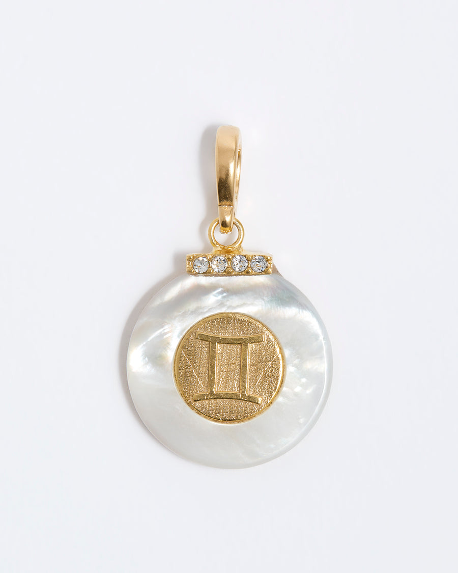 product shot - Gemini engraved gold coin with chunky pearl outer and diamond detailing placed on a white background