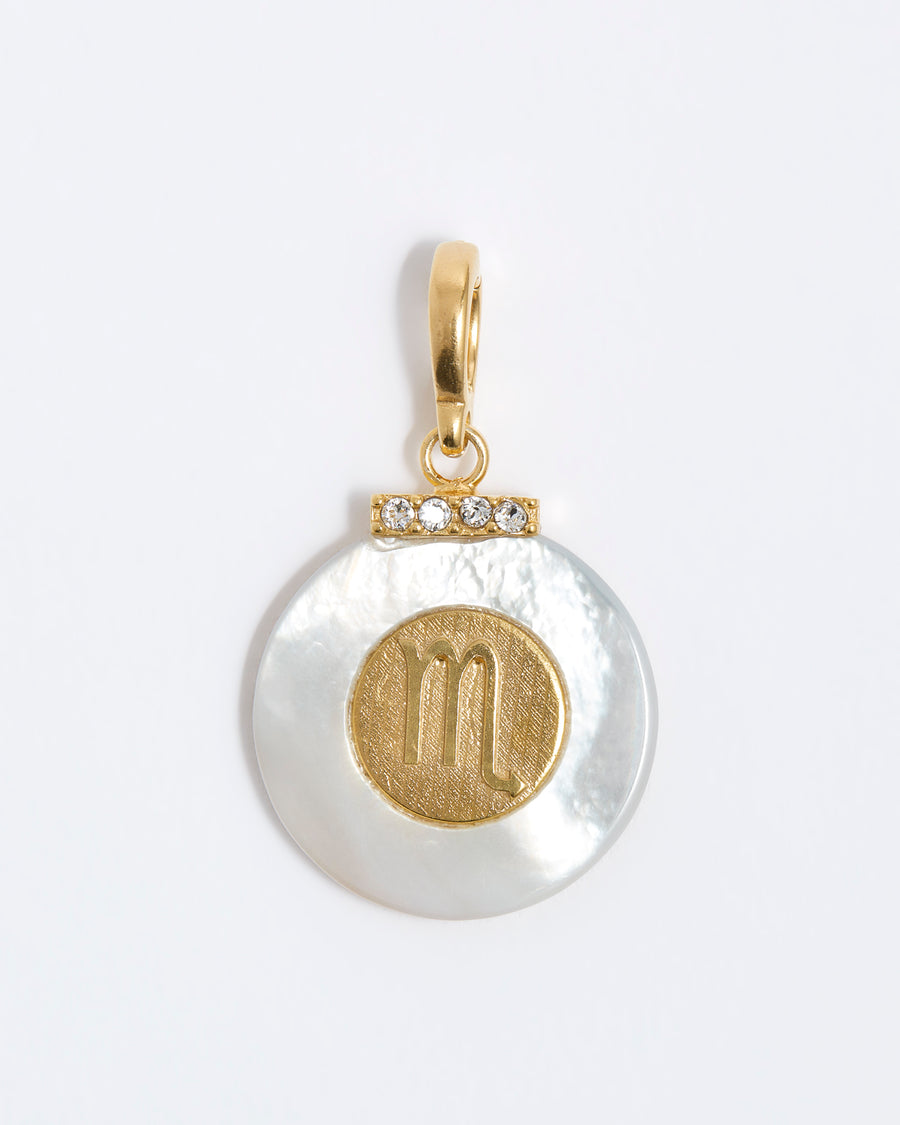 product shot - Virgo engraved gold coin with chunky pearl outer and diamond detailing placed on a white background