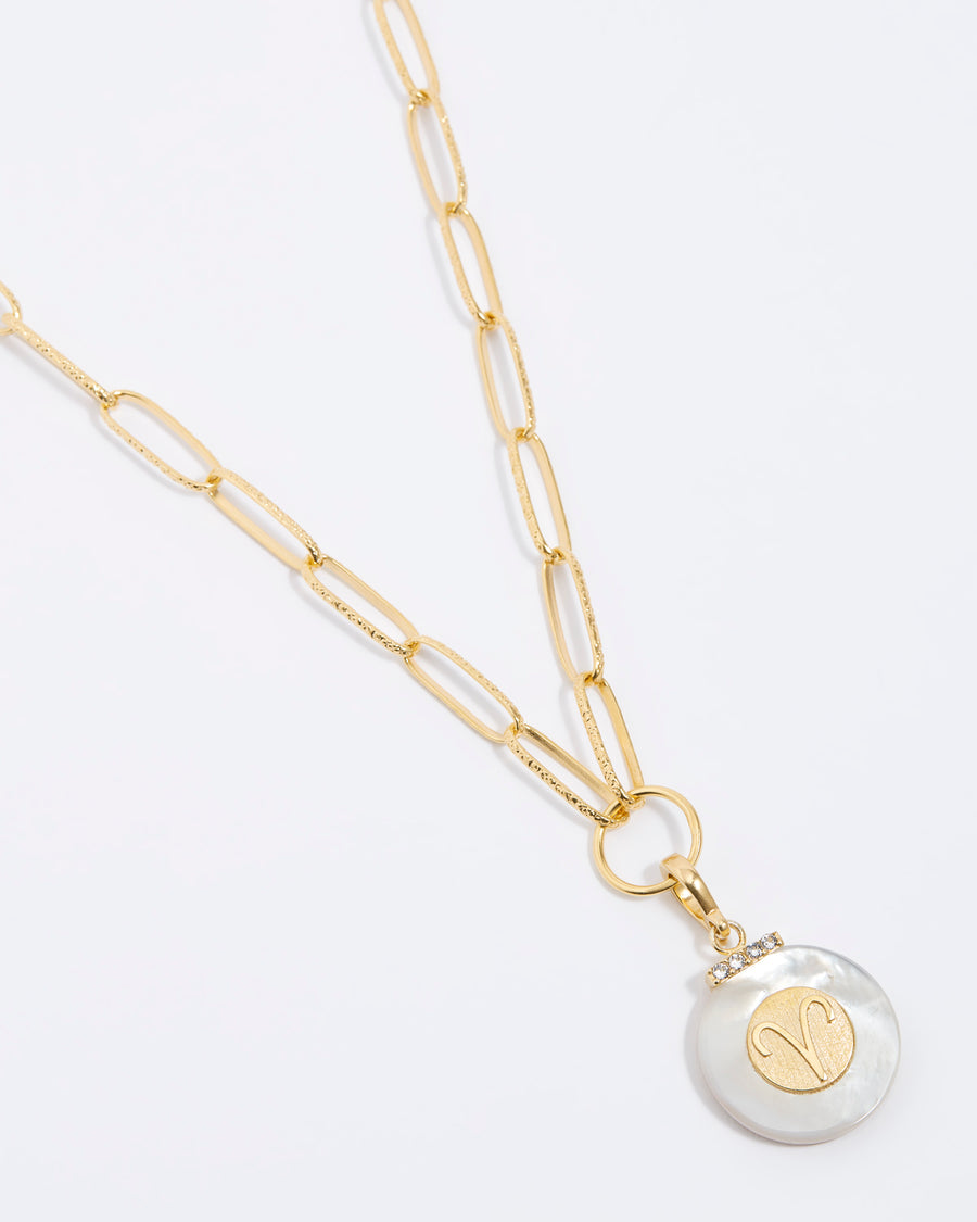 Product shot - Aries engraved gold coin with chunky pearl outer and diamond detailing, on a gold chain, placed on a white background